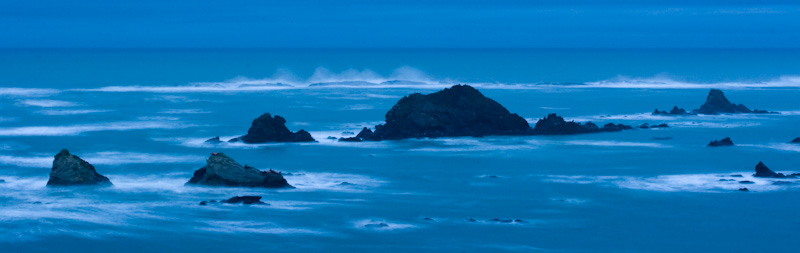 Waves Breaking OVer Simpson Reef At Dawn